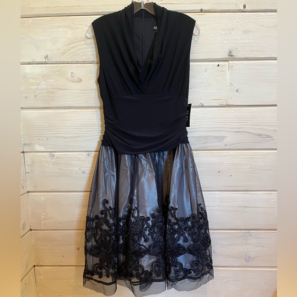 SLNY brand new, never been worn, with tags woman’s black dress!